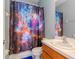 Bathroom featuring vanity, toilet, and shower with space-themed shower curtain at 25925 Terrawood Loop, Land O Lakes, FL 34639