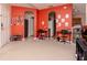 Bonus room with bright orange walls, tile flooring, and open space at 25925 Terrawood Loop, Land O Lakes, FL 34639