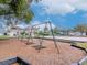 Community playground featuring swings and a volleyball court in the center of the neighborhood at 25925 Terrawood Loop, Land O Lakes, FL 34639