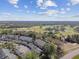 An aerial view captures the community's landscape near golf course, highlighting its scenic location at 3151 Landmark Dr # 123, Clearwater, FL 33761