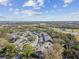 An aerial view captures the community's landscape near golf course, highlighting its scenic location at 3151 Landmark Dr # 123, Clearwater, FL 33761