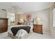 Cozy bedroom with neutral tones, ceiling fan, and ensuite bathroom access for added convenience at 3151 Landmark Dr # 123, Clearwater, FL 33761