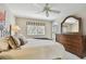 Bright bedroom with a ceiling fan and dresser, offering ample space and comfort at 3151 Landmark Dr # 123, Clearwater, FL 33761