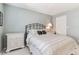 Comfortable bedroom featuring serene color palette, nightstand, closet, and decorative headboard at 3151 Landmark Dr # 123, Clearwater, FL 33761