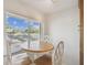 Bright breakfast nook featuring a charming table set and a large window at 3151 Landmark Dr # 123, Clearwater, FL 33761