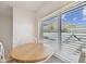 Cozy breakfast nook with views of tree lined streets and blue sky peeking through the blinds at 3151 Landmark Dr # 123, Clearwater, FL 33761