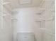 Walk-in closet featuring a shelving system for storing clothes and accessories, plus built-in dresser at 3151 Landmark Dr # 123, Clearwater, FL 33761