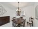 Dining room featuring a chandelier and a view into the kitchen at 3151 Landmark Dr # 123, Clearwater, FL 33761