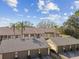 A lovely view of the exterior featuring an attractive two-story building with garages and beautiful tropical landscaping at 3151 Landmark Dr # 123, Clearwater, FL 33761