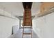A view of the garage interior featuring an attic access ladder at 3151 Landmark Dr # 123, Clearwater, FL 33761