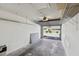 Garage interior with shelving and a view of the home's exterior through the open door at 3151 Landmark Dr # 123, Clearwater, FL 33761