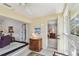 Hallway with access to living room, bedroom, and glass enclosed porch area at 3151 Landmark Dr # 123, Clearwater, FL 33761