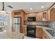 Well-equipped kitchen featuring granite countertops and stainless steel appliances at 3151 Landmark Dr # 123, Clearwater, FL 33761