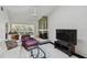 Comfortable living room features a fireplace and cozy seating area with lots of light at 3151 Landmark Dr # 123, Clearwater, FL 33761