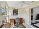 Bright office space with large window, built in desk, and ceiling fan at 3151 Landmark Dr # 123, Clearwater, FL 33761