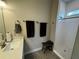 Cozy bathroom featuring a tiled shower, neutral color scheme, and modern sink at 493 Omen St, Punta Gorda, FL 33982