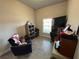 Bright room offering potential as a home office or den with a window and chair at 493 Omen St, Punta Gorda, FL 33982