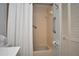 Neutral bathroom featuring tiled shower/tub combination and grab bars for accessibility at 5565 Salem Square N Dr, Palm Harbor, FL 34685