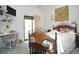 Bright bedroom with a decorative bed, a workspace with desk, and a sliding door, offering comfort and functionality at 5565 Salem Square N Dr, Palm Harbor, FL 34685