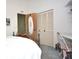 Bright bedroom featuring a decorative bed and a closet and showing doorway leading to another room at 5565 Salem Square N Dr, Palm Harbor, FL 34685