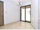 Empty Dining Room featuring tile flooring and sliding glass doors at 5565 Salem Square N Dr, Palm Harbor, FL 34685