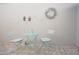Charming courtyard patio with a table and chairs, perfect for relaxing outdoors at 5565 Salem Square N Dr, Palm Harbor, FL 34685