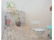 Cozy outdoor patio area with brick flooring and seating near a potted tree at 5565 Salem Square N Dr, Palm Harbor, FL 34685