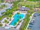 Beautiful aerial view of the community pool, playground, and green space with ample parking at 11811 Meadowgate Pl, Bradenton, FL 34211