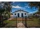 Backyard of a charming home featuring a custom wood deck and fenced yard at 2835 Freemont S Ter, St Petersburg, FL 33712