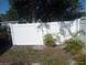 Enclosed backyard featuring a pristine white privacy fence and young palm trees at 2835 Freemont S Ter, St Petersburg, FL 33712