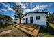 Backyard of a charming home featuring a custom wood deck and fenced yard at 2835 Freemont S Ter, St Petersburg, FL 33712