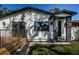 Charming home with a well-manicured lawn, stone columned entryway, and inviting wooden deck at 2835 Freemont S Ter, St Petersburg, FL 33712