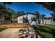 Charming home with a well-manicured lawn, stone columned entryway, and inviting wooden deck at 2835 Freemont S Ter, St Petersburg, FL 33712