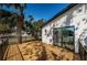 Side yard of a charming home featuring a custom wood deck and well manicured landscaping at 2835 Freemont S Ter, St Petersburg, FL 33712