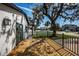 Side yard of a charming home featuring a custom wood deck and well manicured landscaping at 2835 Freemont S Ter, St Petersburg, FL 33712