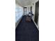 Enclosed sunroom features seating, a washer/dryer, and access to the outdoors at 301 Andover S Pl # 185, Sun City Center, FL 33573