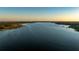 Expansive aerial view showcases the lake's size and beautiful surroundings at 10532 94Th Pl, Seminole, FL 33772