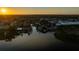 Aerial view captures a charming waterfront community with canals and lush greenery at 10532 94Th Pl, Seminole, FL 33772