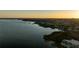 Scenic aerial view of the lake, shoreline, and homes at 10532 94Th Pl, Seminole, FL 33772