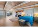 Cozy bedroom with wood ceiling, brick fireplace, and backyard access at 10532 94Th Pl, Seminole, FL 33772