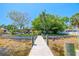 Private dock leading to a home with lush landscaping and water views, perfect for waterfront living at 10532 94Th Pl, Seminole, FL 33772