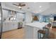 Charming kitchen with white cabinets and a convenient center island at 10532 94Th Pl, Seminole, FL 33772