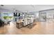 Spacious living room with abundant natural light and lake views at 10532 94Th Pl, Seminole, FL 33772