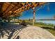 Waterfront property featuring a beautiful patio with wooden pergola and stunning views at 10532 94Th Pl, Seminole, FL 33772