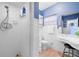 Bathroom features shower and vanity with storage at 10532 94Th Pl, Seminole, FL 33772