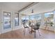 Bright sunroom offers panoramic views and stylish seating area at 10532 94Th Pl, Seminole, FL 33772