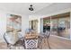 Cozy sunroom with stylish seating and serene views through sliding glass doors at 10532 94Th Pl, Seminole, FL 33772