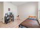 Cozy bedroom with wood-look flooring, a study desk, and a comfortable bed at 11976 Brighton Knoll Loop, Riverview, FL 33579