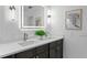 Modern bathroom with dual sinks, a lighted mirror, and stylish fixtures at 156 29Th N Ave, St Petersburg, FL 33704