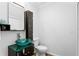 Bathroom with a distinctive vessel sink and unique glass-topped cabinet at 156 29Th N Ave, St Petersburg, FL 33704
